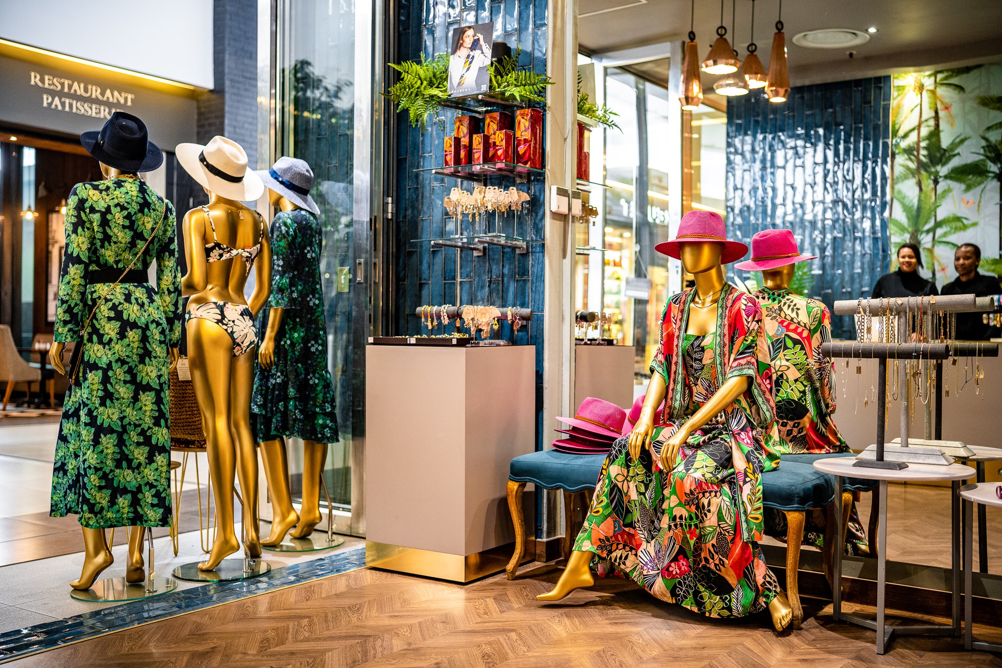 Sitting lady mannequin used in a colourful retail display