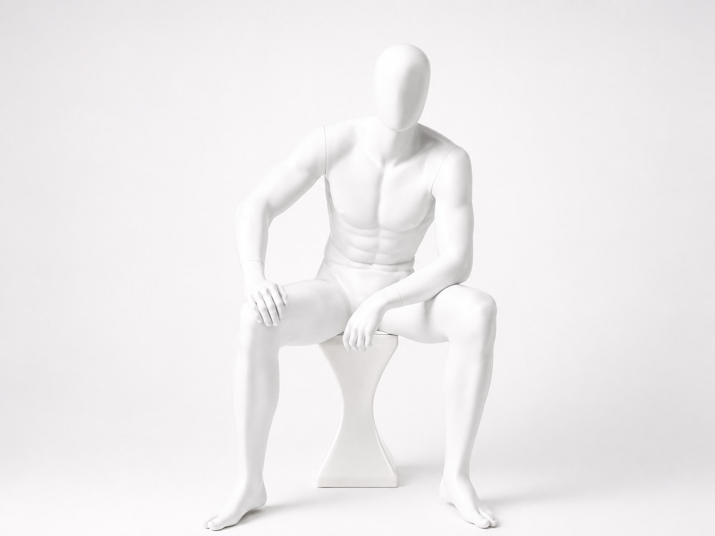 Male mannequin in a seated pose
