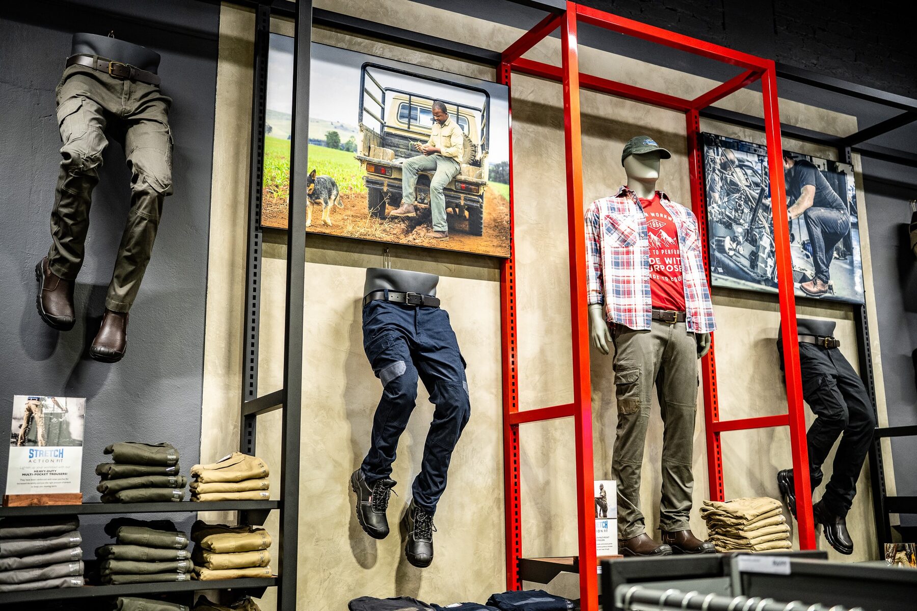 Bent-leg trouser forms and a full mannequin used in a Jonsson Workwear retail display