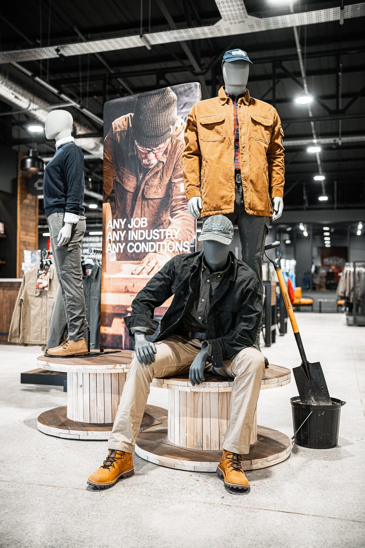 Standing and seated mannequins styled in practical workwear